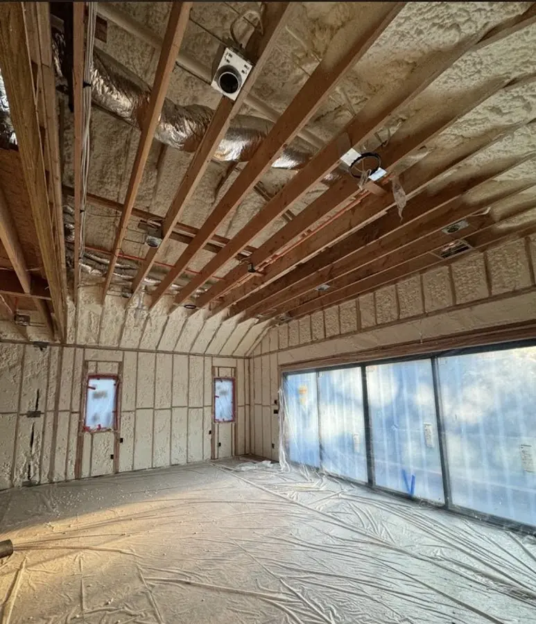 Interior walls and ceiling insulated with spray foam during new construction in Port Huron